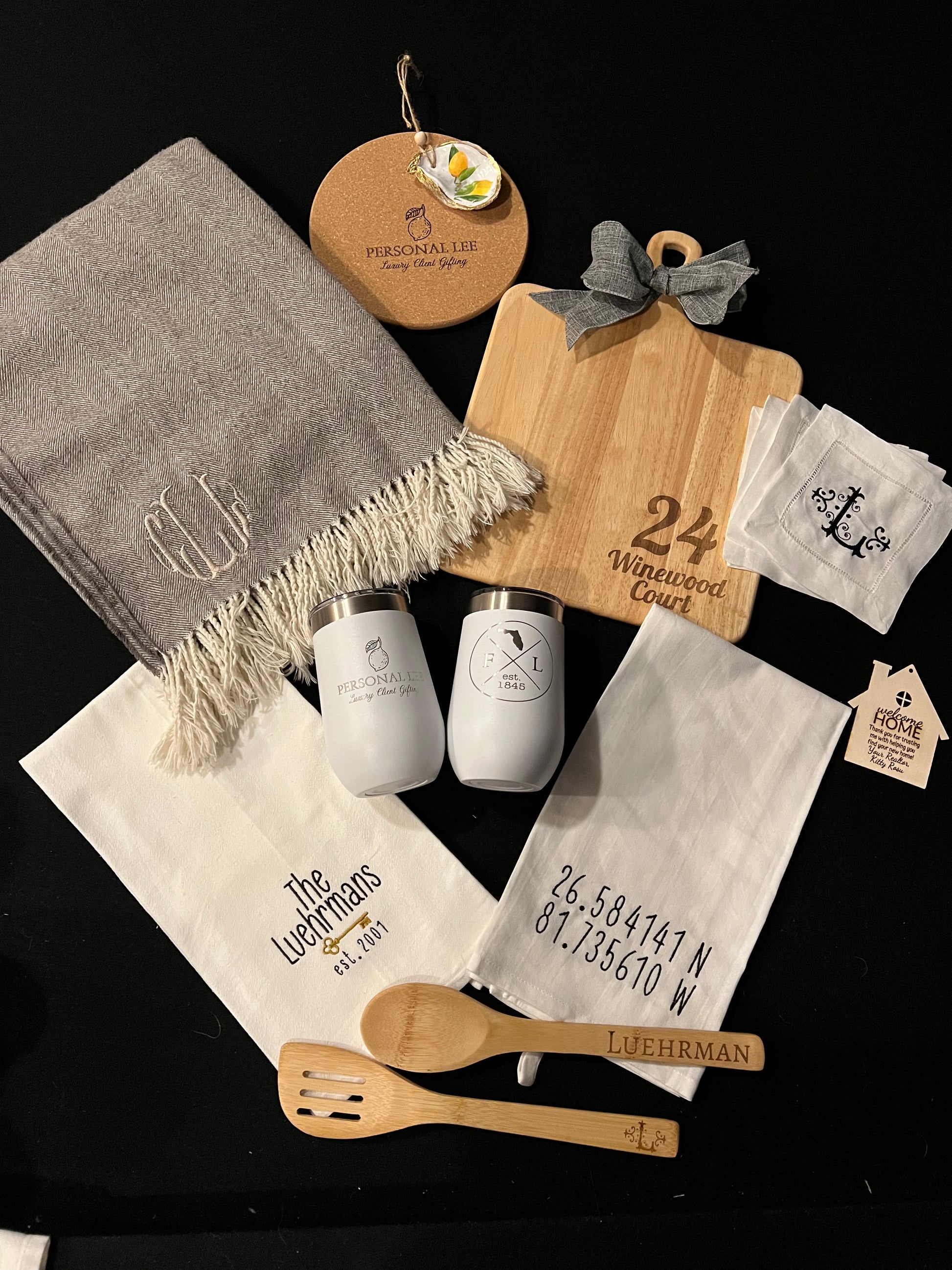 The Dream Home Basket includes a luxe throw, large customer cutting board and more!